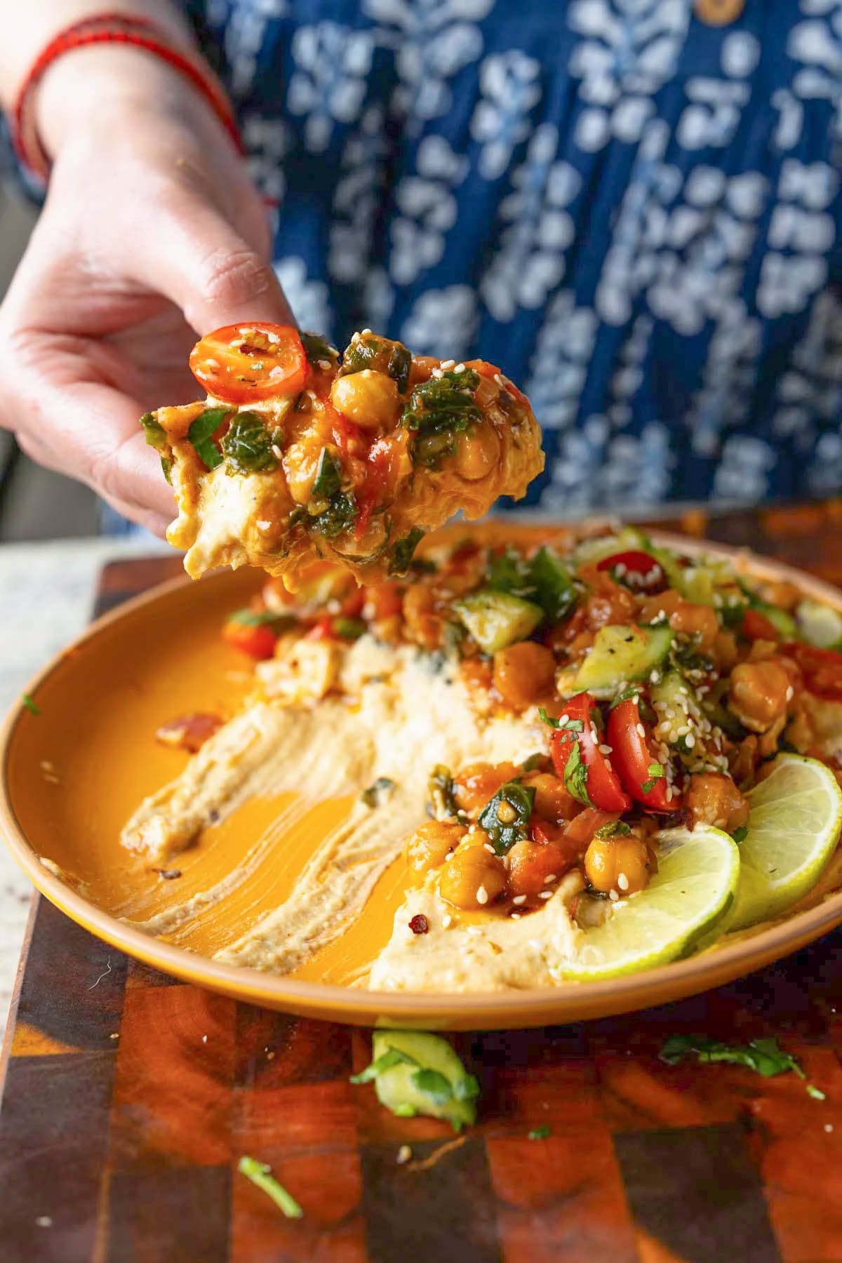 scooping up some of the peri-peri chickpeas from the dip platter
