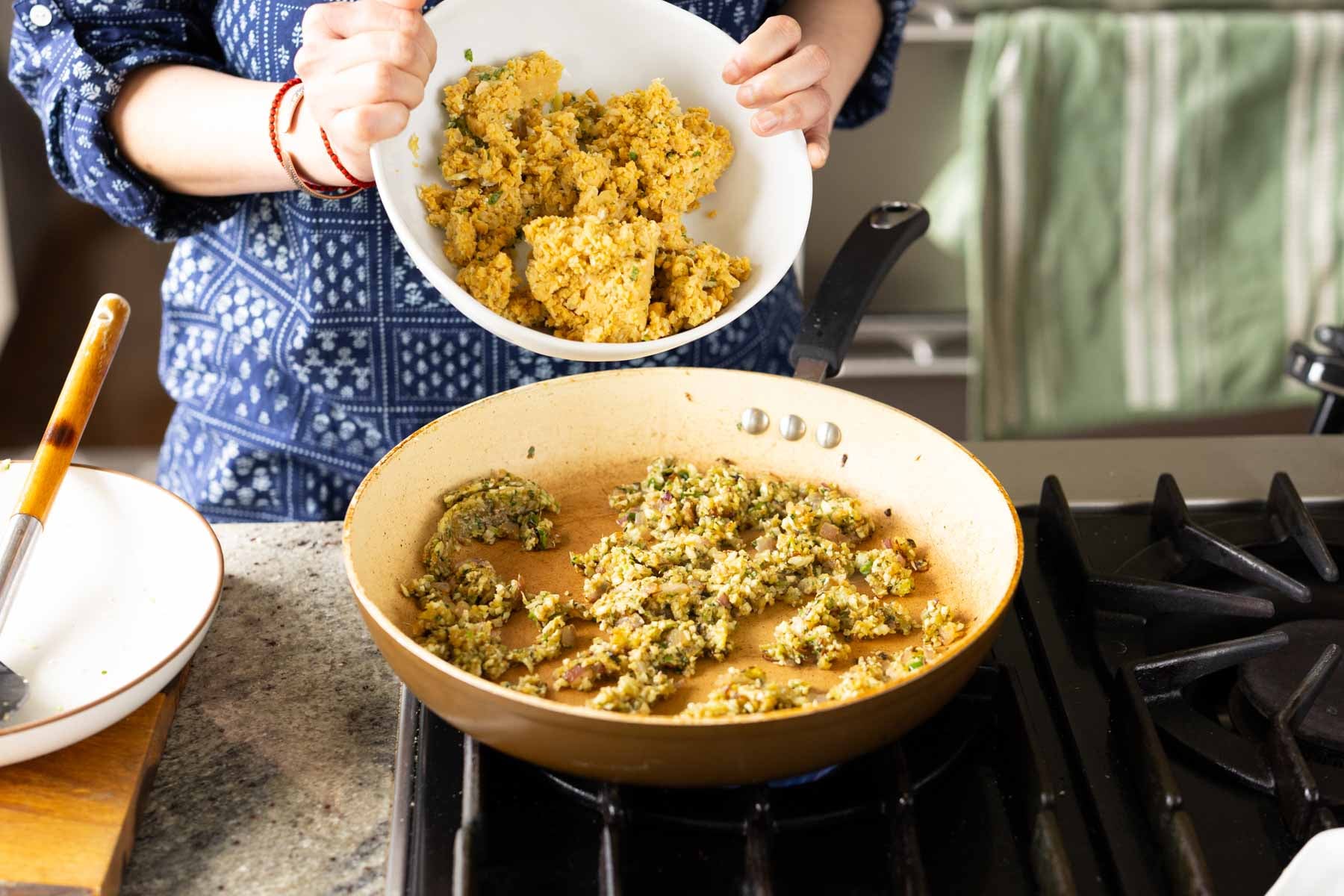 adding the mashed chickpeas to the pan