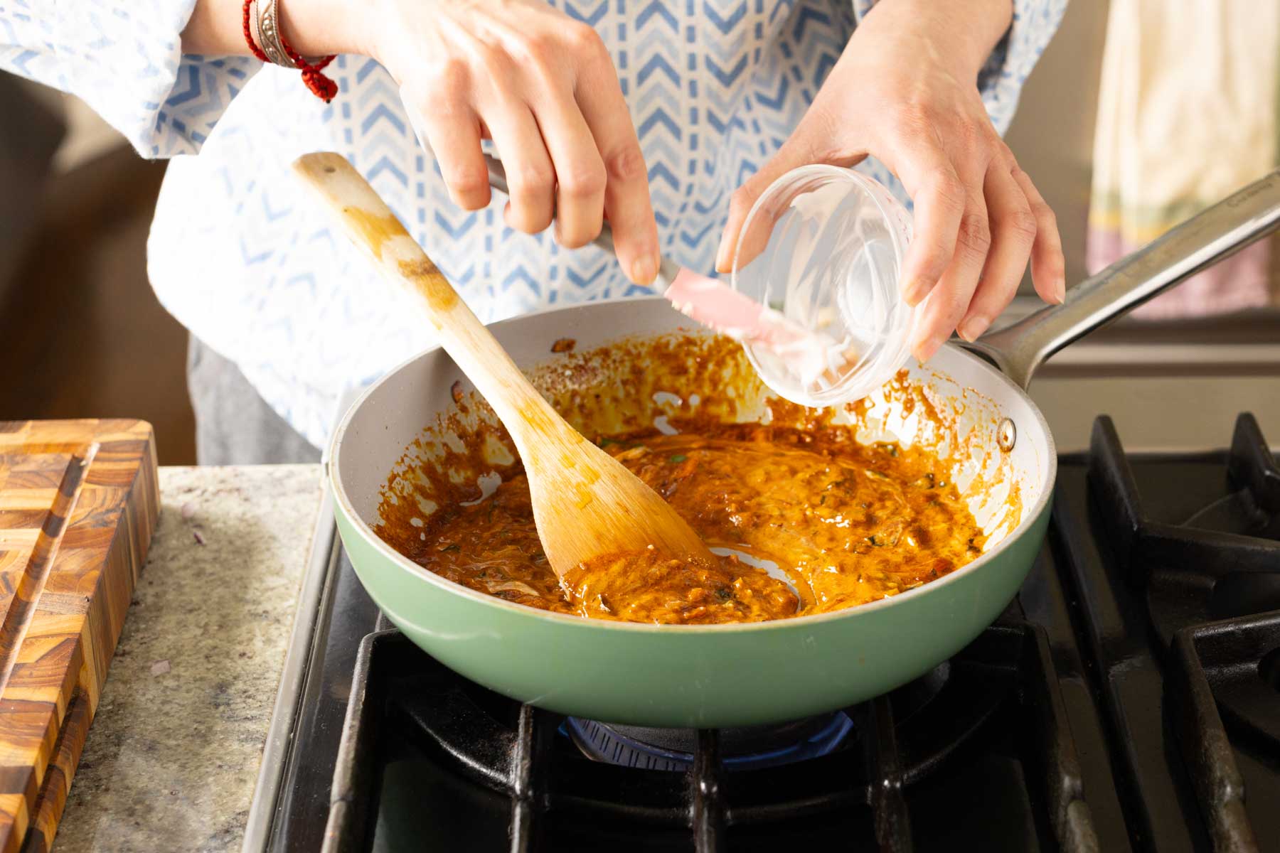 adding yogurt to the pan
