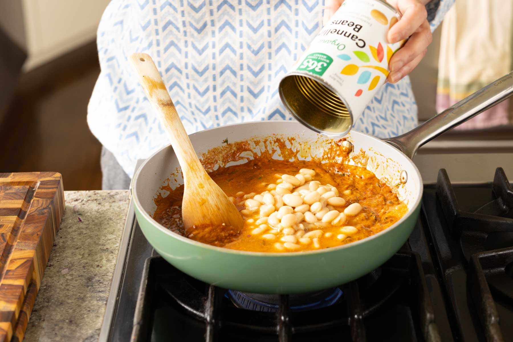 adding chickpeas to the pan