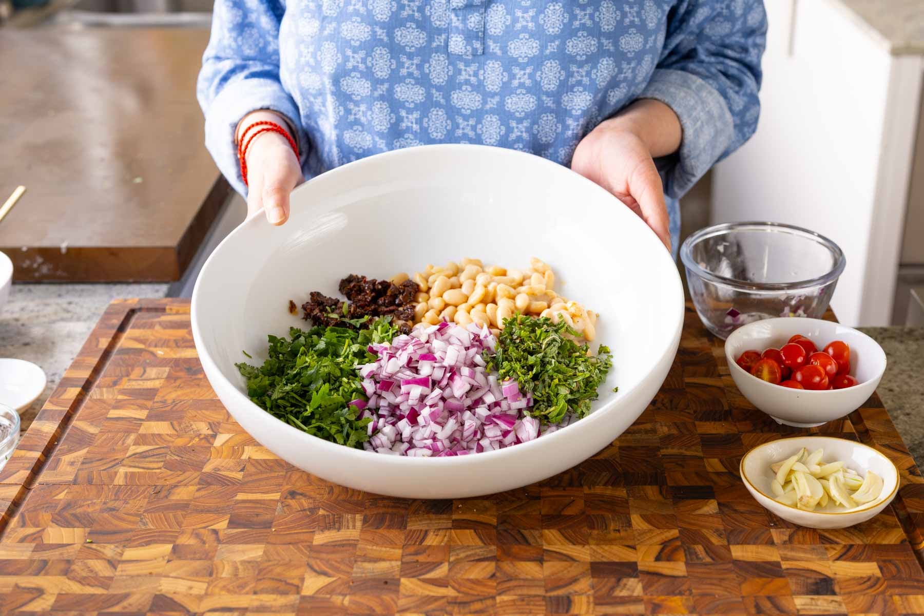 white bean salad ingredients in the bowl