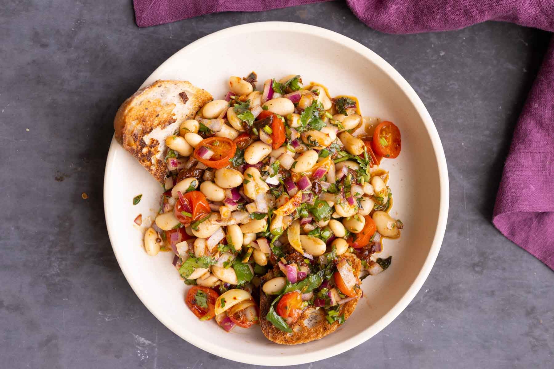 marinated white bean salad with bread to dip