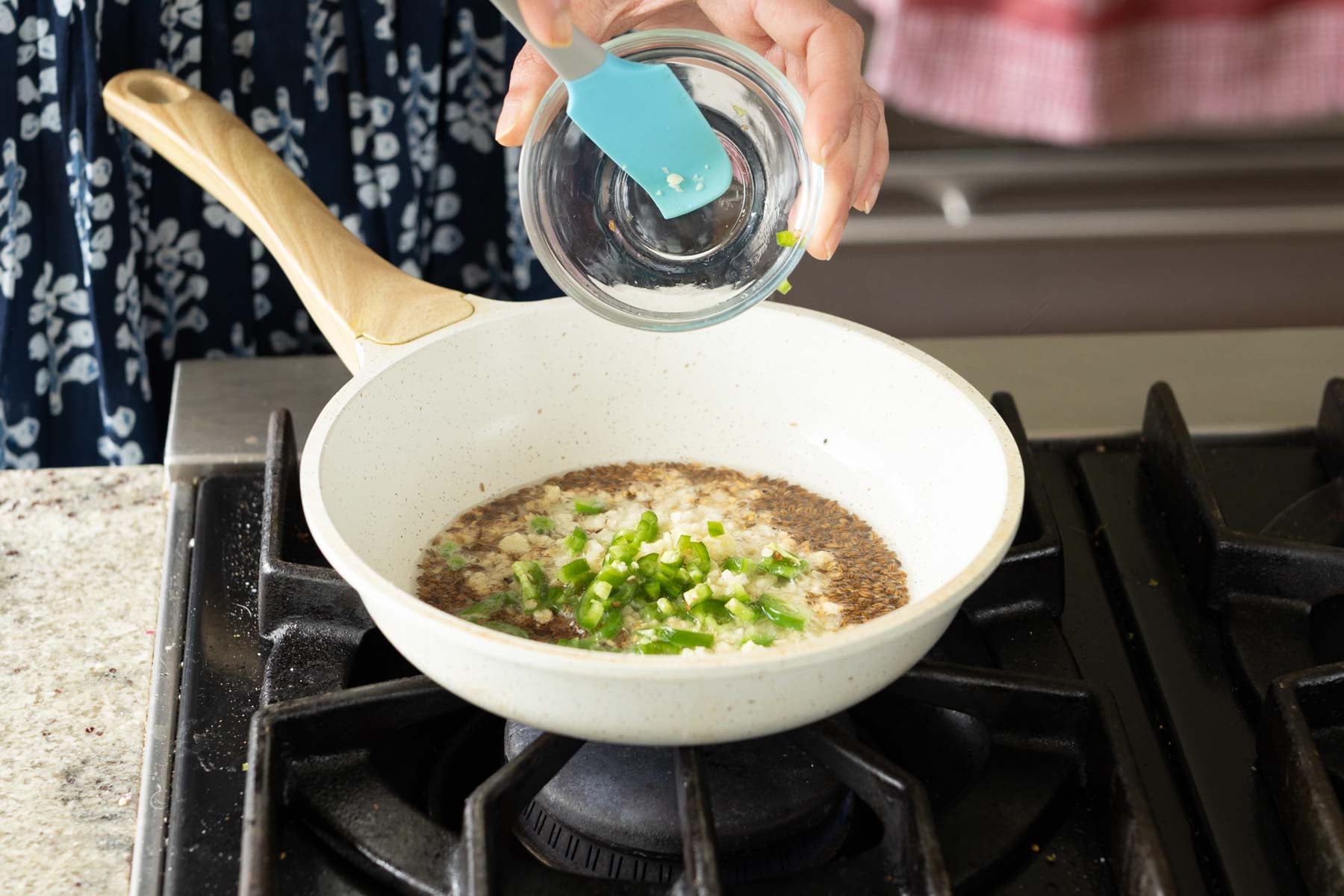 adding the tadka ingredients to the pan
