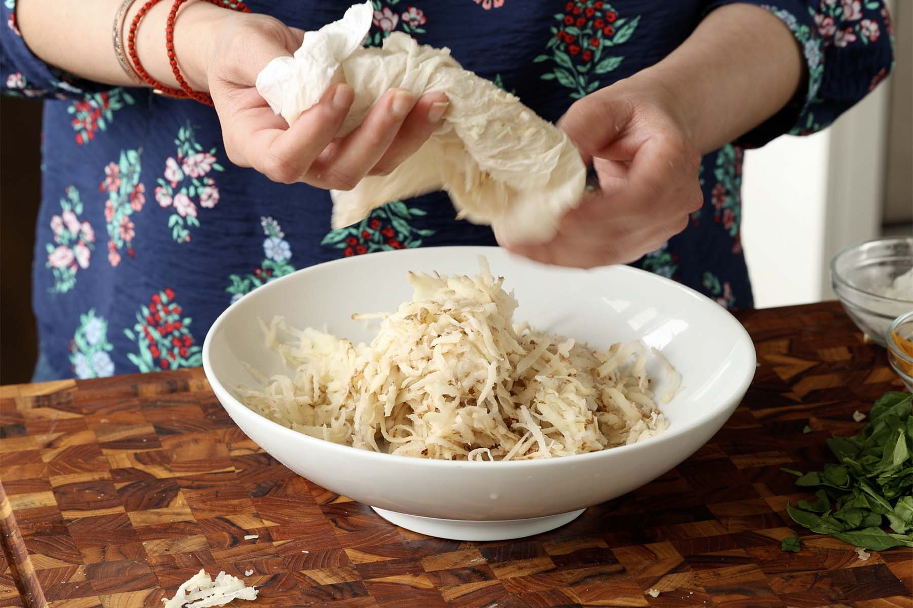 transferring the potatoes to a bowl