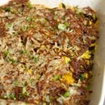 hashbrown casserole in the pan after adding the hashbrowns on top