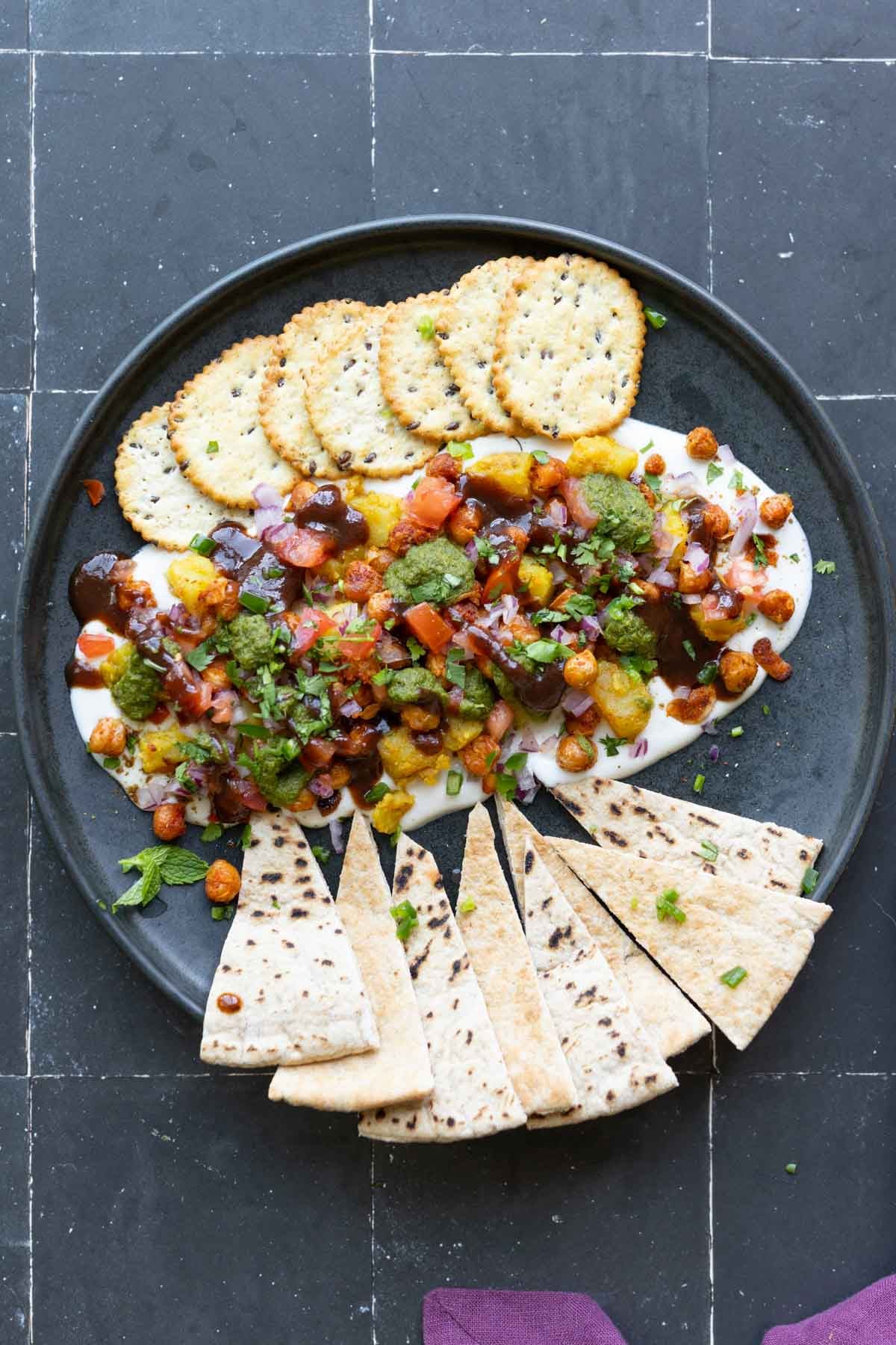 samosa platter with crackers and pita triangles